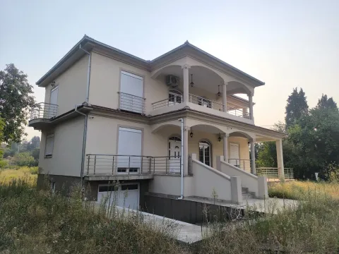 Exterior view of a two-story house with terraces and a yard. - image 2