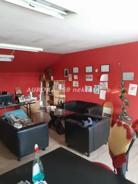 Living room with seating furniture and a desk. - image 3