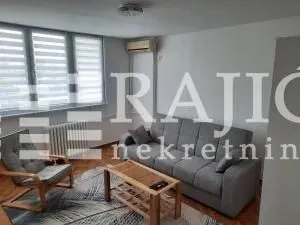 Furnished living room with sofa, armchair and coffee table.