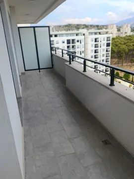 Spacious tiled terrace with a view of the city and surroundings. - image 9