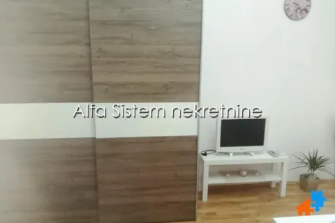 Living room with a large wardrobe and a television on a small table. - image 8
