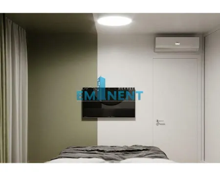 Bedroom with a bed, wall-mounted TV, and air conditioning unit. - image 7