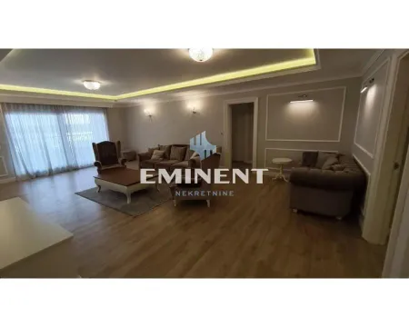 Spacious living room with a sofa set, coffee table, and lighting. - image 2