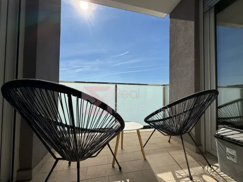 Furnished terrace with two black chairs and a view of the sky. - image 6