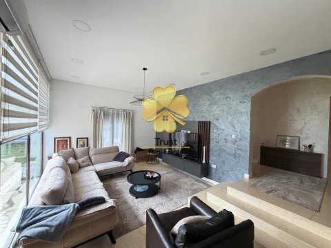 Modern living room with a sofa and TV unit. - image 5