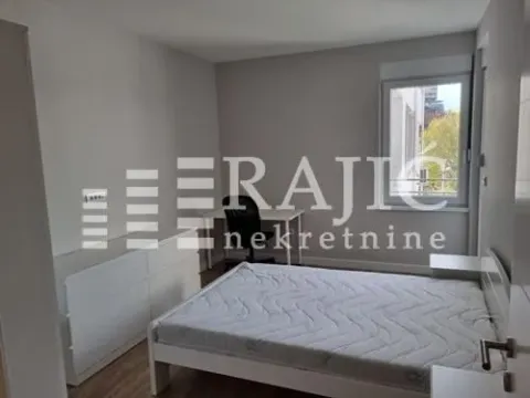 Furnished bedroom with a double bed, a desk, and a white chest of drawers. - image 6
