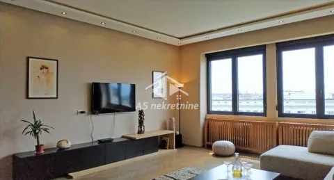 Spacious living room with seating area, TV and large windows. - image 2