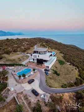 Aerial view of a modern villa with a swimming pool and sea view. - image 39