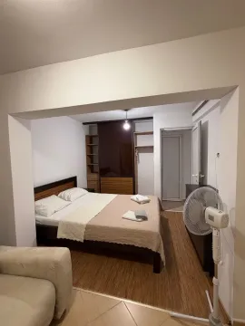 View from the living room into the bedroom with a double bed and wardrobe. - image 7