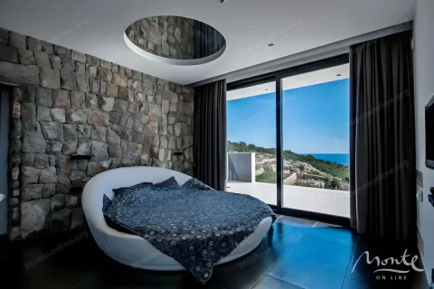 Modern bedroom with a circular bed and sea view. - image 13