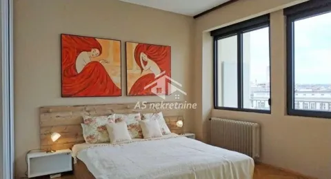 Bedroom with a double bed, wooden headboard, and artwork on the wall. - image 9