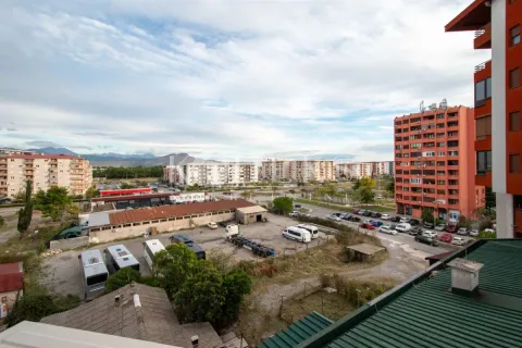 View from the terrace of the city neighborhood and surrounding buildings. - image 7