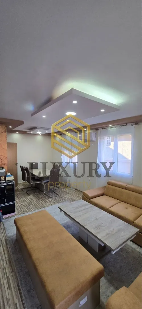 Spacious living room with a sofa set and dining area.