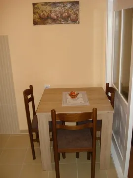 Dining table with chairs in the kitchen. - image 6