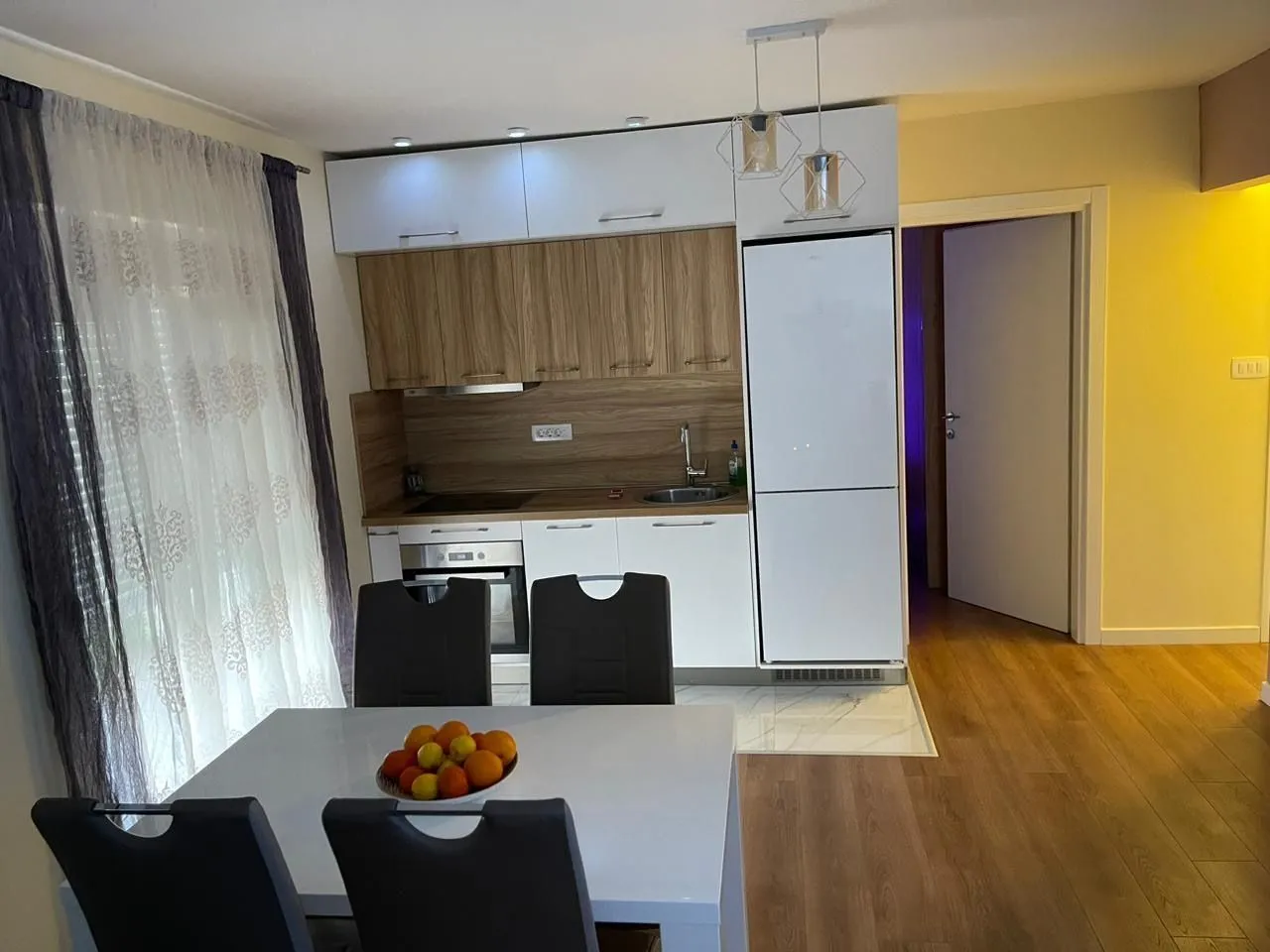 Bright kitchen with a dining table in a modern apartment.