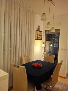 Dining area with a table, chairs, and pendant lighting. - image 9