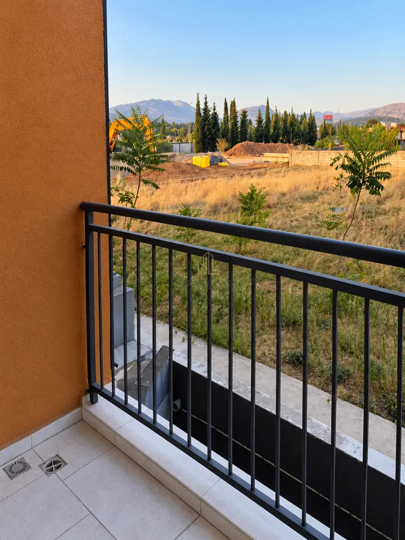 View from the balcony overlooking the yard and surrounding landscape.
