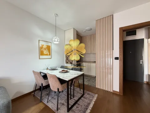 Living room with dining area and kitchen in the background. - image 4