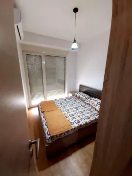 A bedroom with a double bed. - image 13
