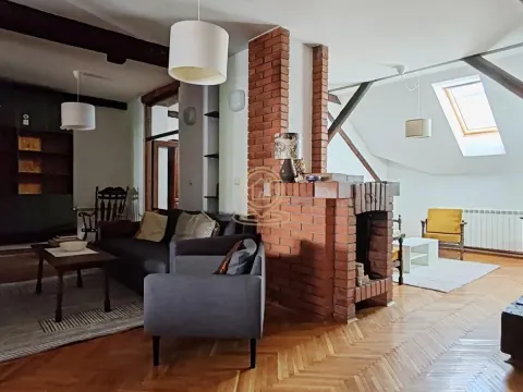 Spacious living room with a fireplace, parquet flooring, and skylights. - image 9