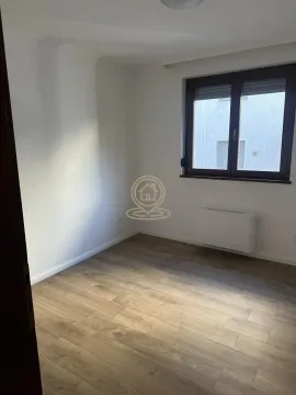 Empty room with white walls, wooden flooring and a window. - image 8