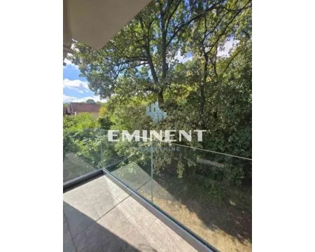 View from the terrace overlooking green tree canopies and surroundings. - image 12