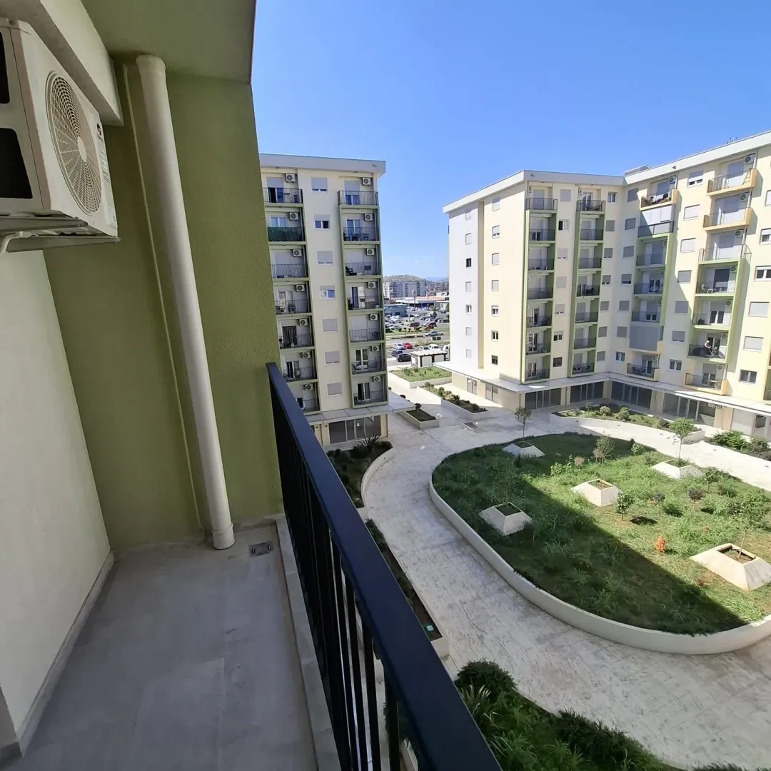 View from the terrace overlooking the courtyard and surrounding residential buildings.