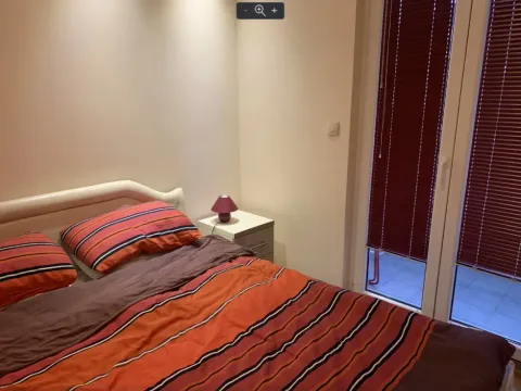 Bedroom with a double bed and a nightstand. - image 10