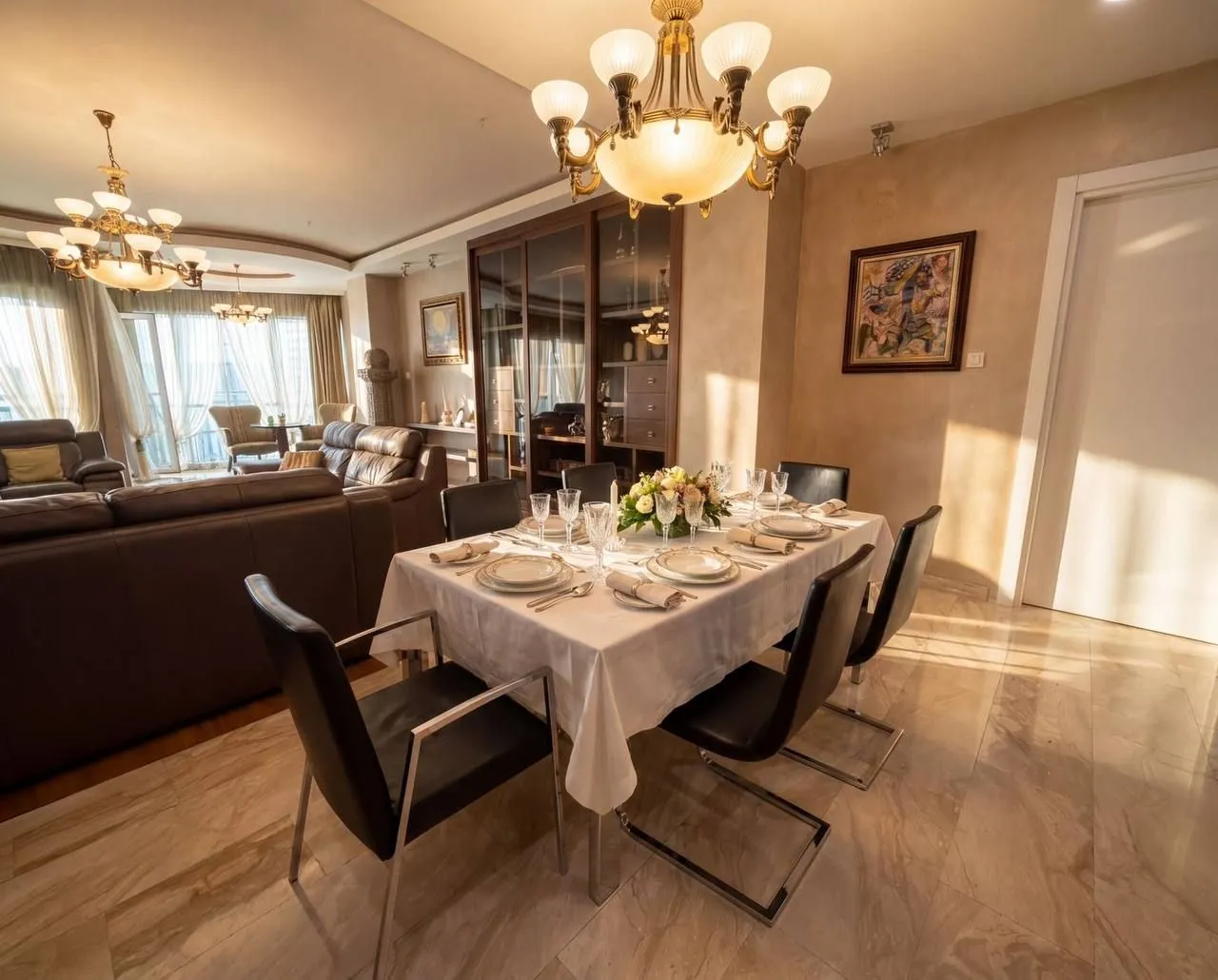 Spacious living room with a dining area and elegant furniture.