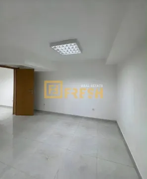 Empty room with white walls and tiled floor. - image 11