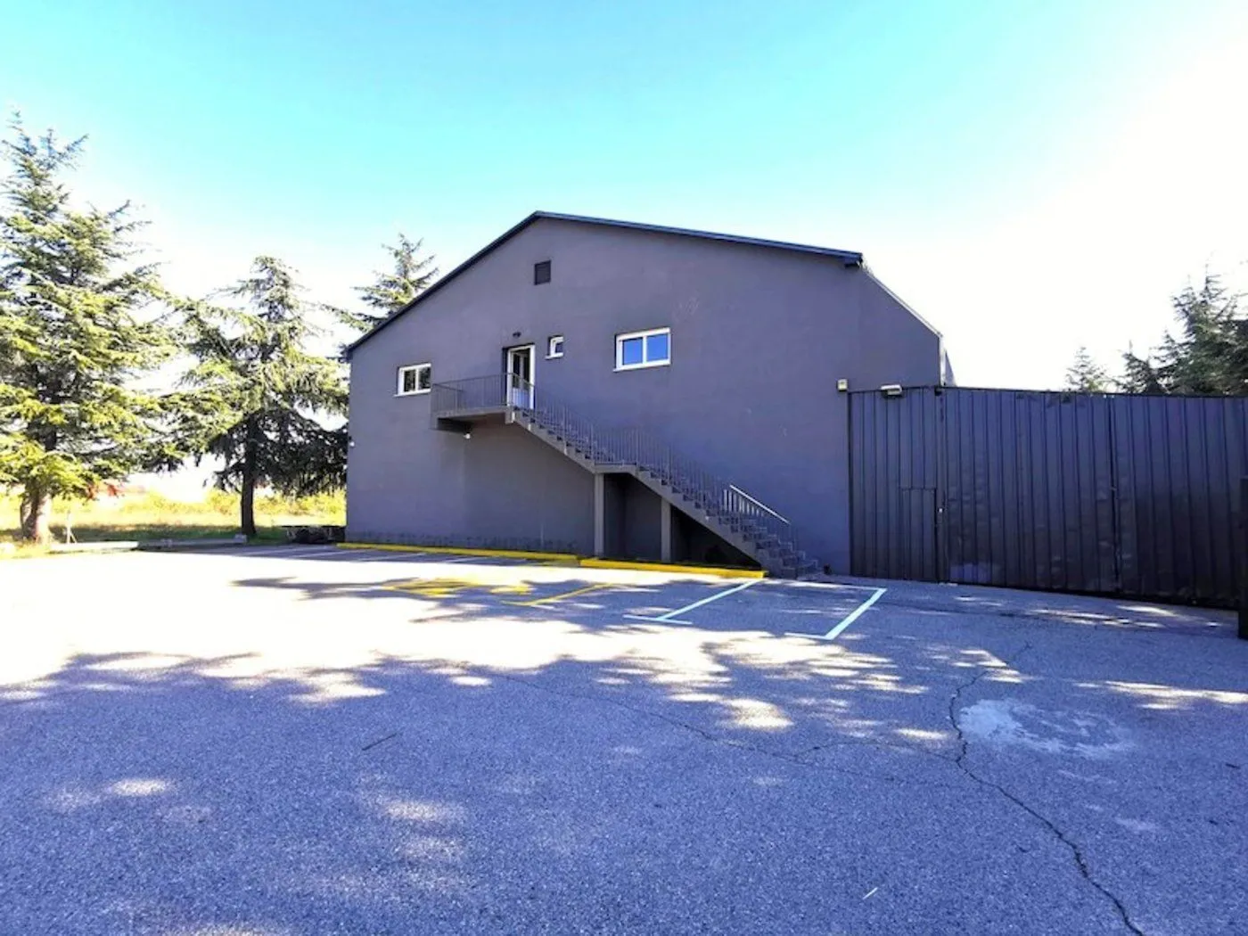 Exterior view of a commercial building with a parking lot.