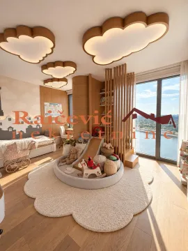 Children's bedroom with a bed, toys, and a river view. - image 18