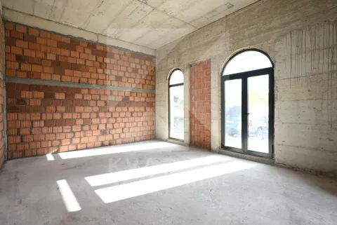 Unfinished room in grey phase with windows and doors. - image 8