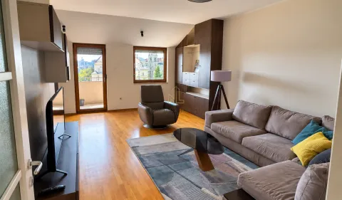 Furnished living room with a sofa, TV, and access to the terrace. - image 2