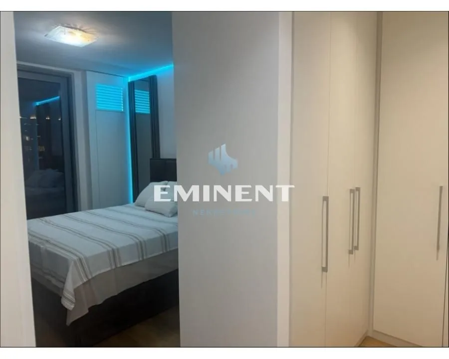 Bedroom with a double bed and fitted wardrobes.