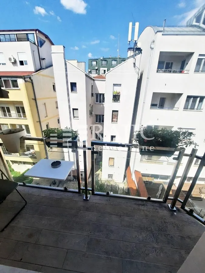 View from the balcony overlooking surrounding residential buildings.