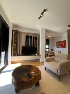 Living room with armchairs, TV unit, and dining area in the background. - image 14