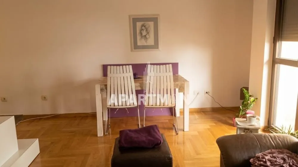 Living room with a dining table and chairs.