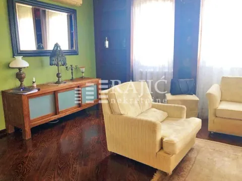 Living room with furniture and green walls. - image 8