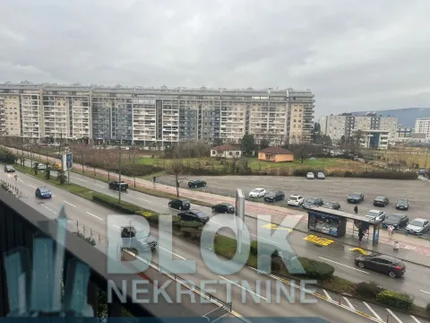 View from the window of the street and surrounding buildings. - image 7