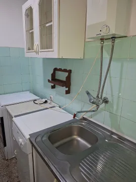Older kitchen with a sink, cabinetry, and appliances. - image 10