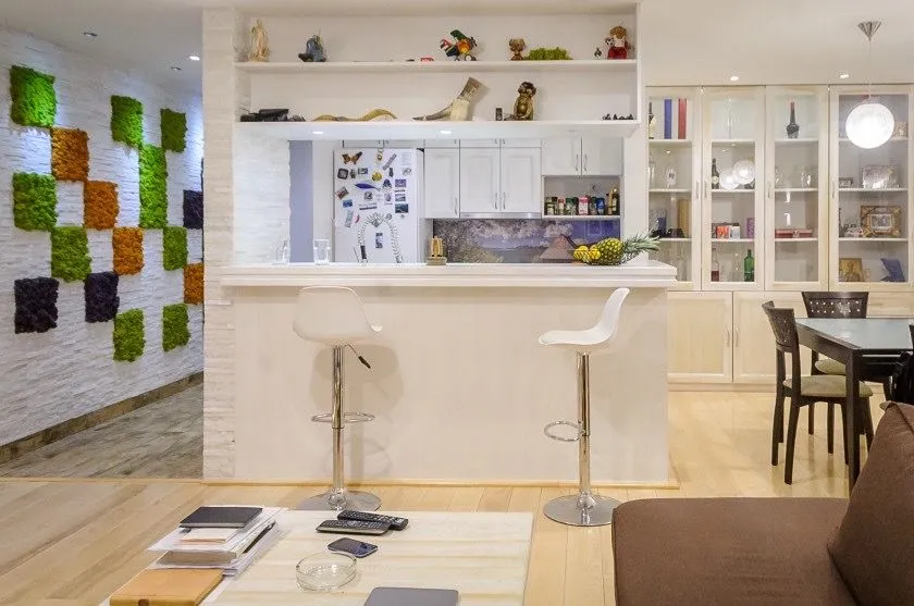 Living room with a breakfast bar overlooking the kitchen.