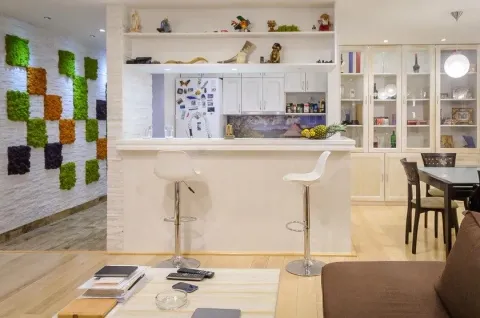 Living room with a breakfast bar overlooking the kitchen. - image 3