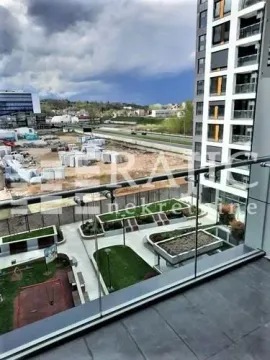 View from the terrace overlooking the courtyard and surrounding buildings. - image 7