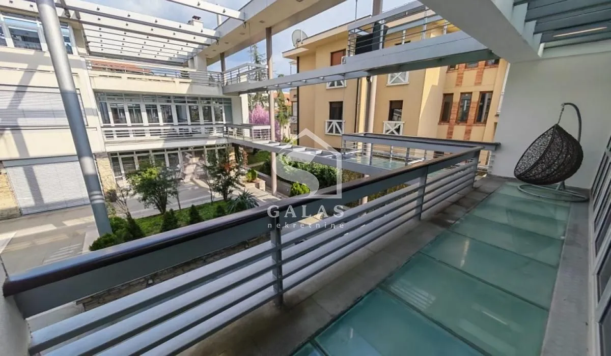 Large terrace overlooking the inner courtyard and surrounding buildings.