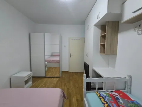 Children's bedroom with beds, a desk, and wardrobes. - image 7