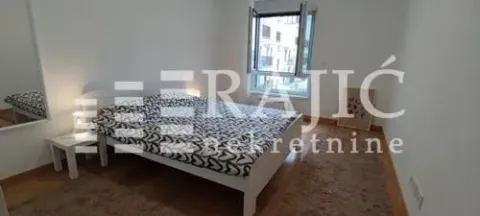 Bedroom with a double bed, wardrobe, and a window. - image 8