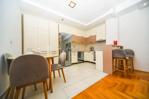 Modern kitchen with dining area and built-in appliances. - image 4
