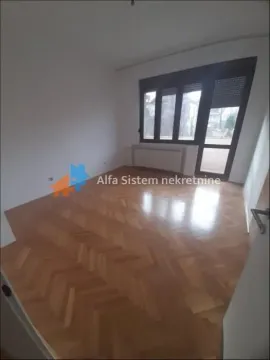 Empty room with parquet flooring and access to the terrace. - image 14