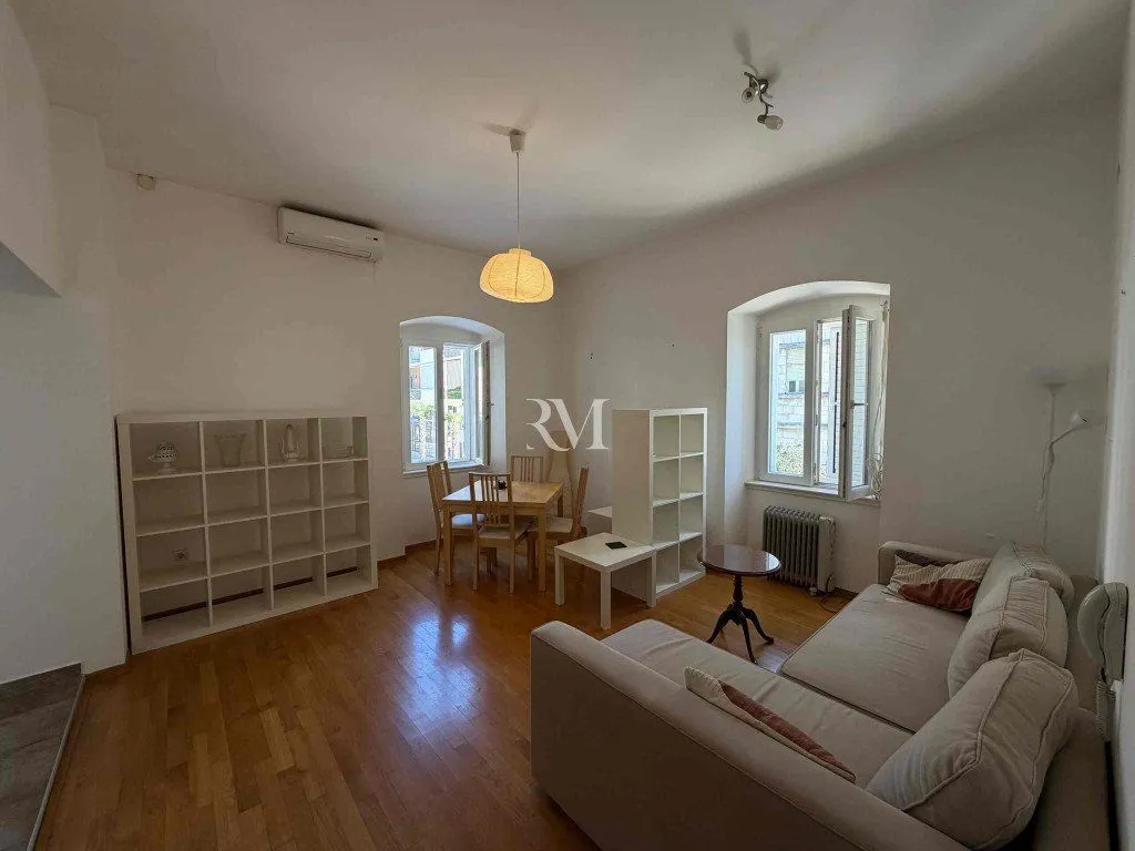 Spacious living room with a dining area and seating set.